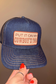 PUT IT ON MY COWBOY'S TAB Embroidered Patch on Structured Trucker Hat